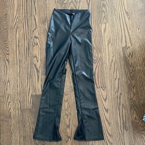 Faux leather pants with slit bottoms